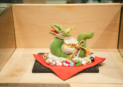 Japanese zodiac dragon figurine displayed at Sushi Shutatsu, a Tokyo sushi restaurant