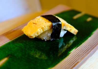 Traditional Japanese tamago nigiri served at Sushi Shutatsu in Ogikubo.