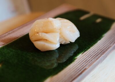 Fresh scallop nigiri served at Sushi Shutatsu in Ogikubo.