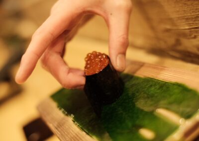 Ikura salmon roe gunkan sushi being served at Sushi Shutatsu in Ogikubo, Tokyo.