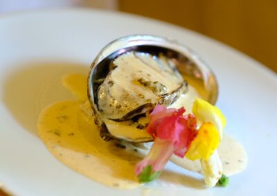 Abalone served in a rich liver sauce with seasonal garnish at Sushi Shutatsu in Ogikubo.