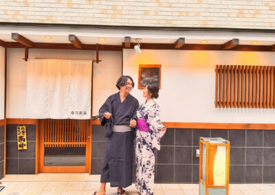 Guests wearing traditional yukata in front of Sushi Shutatsu in Ogikubo, Tokyo, before enjoying the omakase experience