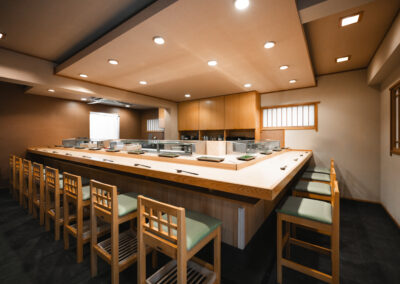 Interior of Sushi Shutatsu in Ogikubo, Tokyo, featuring a traditional Japanese omakase counter with wooden seating